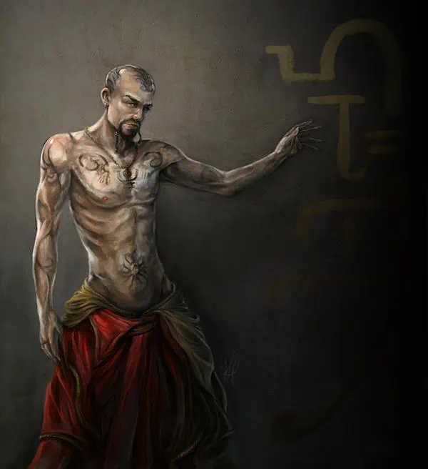 A pale man stands in a red and gold long, voluminous skirt. His scalp, upper chest, navel, and arms are imprinted with dark tattoos.